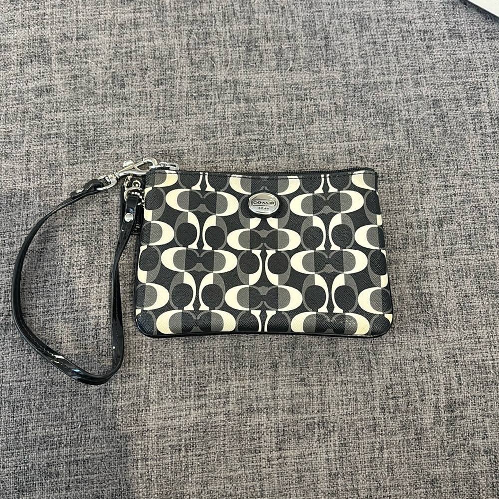Coach EUC black, white, and gray logo zip-top wristlet with mini hang tag